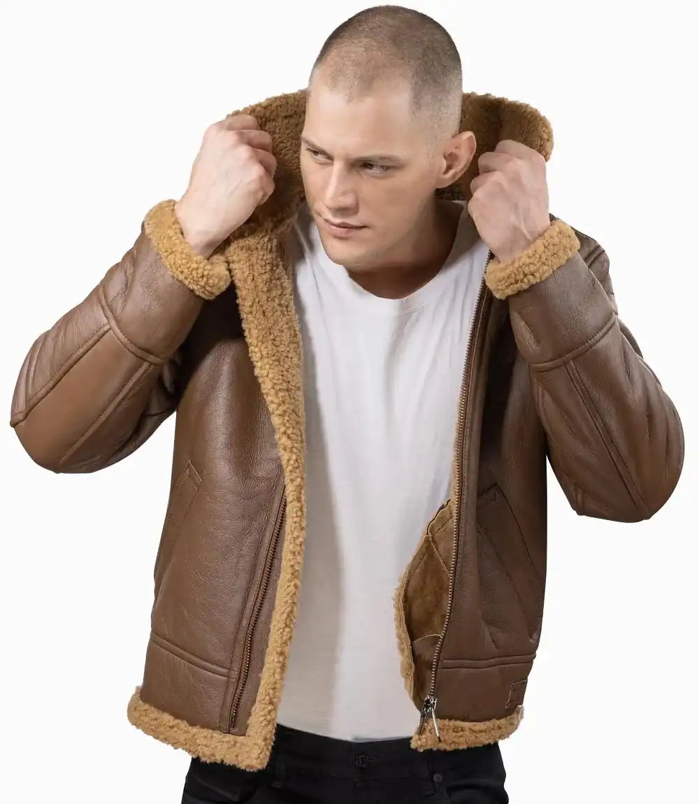 Man wearing a brown leather jacket with fur lining on a white background